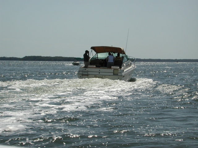 Another group is out boating, if you look the guy on the left is snapping a picture of his baby.