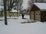 As we go over to Gramma's, we see neighbor Carol digging out from the snow.  She knows she really wants to be in Florida... 