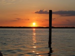 Final view of sunset from the boat (with piling).