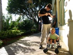 Uncle Adam tightens his sunglasses while Paige-E watched dad take a photo.