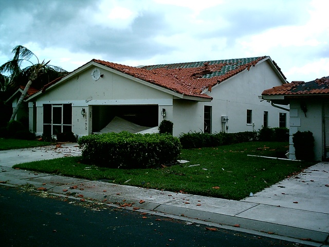 Garage door completely blown out, pieces of things stuck in the walls.