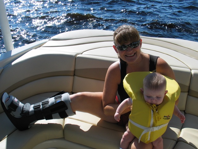 Mommy reviews proper boating etiquette with Josie.  (Mom also has a leg brace on from severely pulling a muscle playing tennis with daddy last week!)