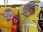 "Josie, it's okay - boating is fun!" Paige tells Jojo who doesn't like to be squeezed in her life jacket. 