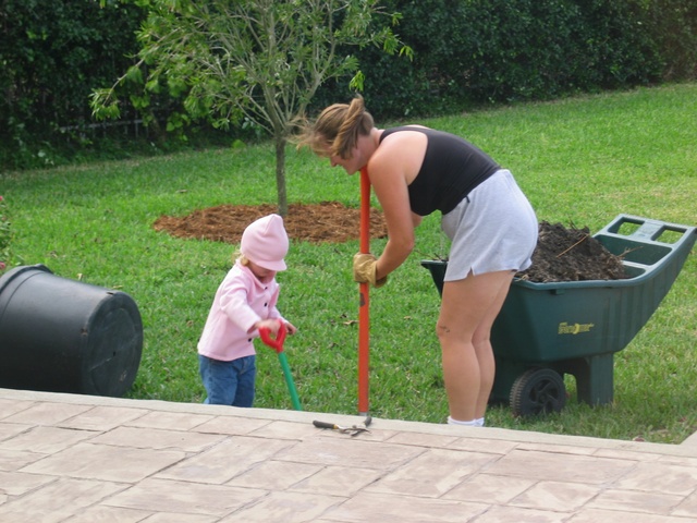 As mom was out digging, Paige asked if she could help, so we dressed her up (it was in the upper 60's!) and got her shovel - away she went!