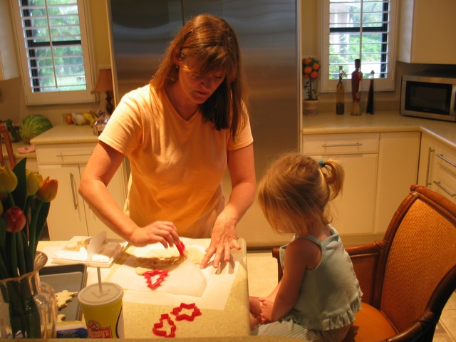 Mom and Paige make Christmas cookies...