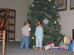 Paige shows Connor some of her favorite ornaments on the tree.