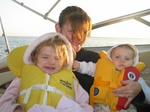 We're on our way back from boating all day - it's getting chilly and the kids are relaxing on mom's lap.