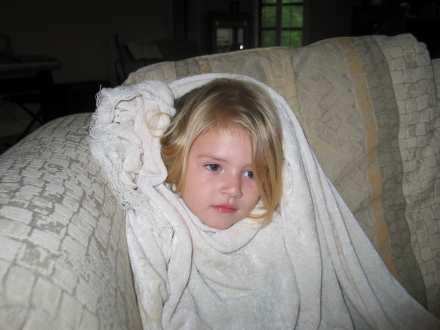 Paige's bundled up watching one of her favorite shows - the Wiggles!