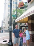 Jon stands under the BD Mongolian BBQ sign, while Tara & Ashley fix Paige's hair!