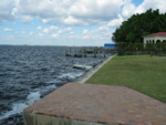 AWESOME! Alan finally got a boat!!  (Zoom in to see it!)  Hurricane Wilma blew this boat (we have no idea where it came from!) into their seawall, and it's been there ever since!