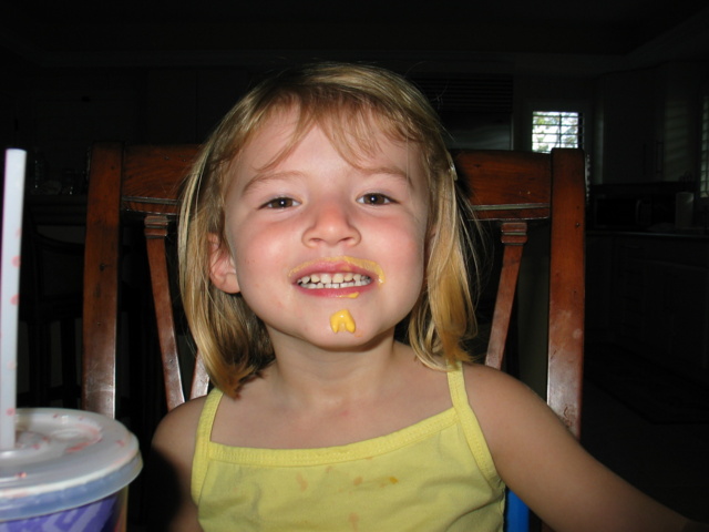 Paige proudly displaying her moustache and beard made of cheese!