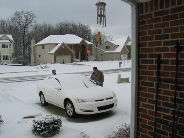 Jon was nice enough to capture this photo of me cleaning off the rental car...