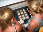 The girls frosting the cupcakes...