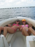 The girls relax in the front of the boat...