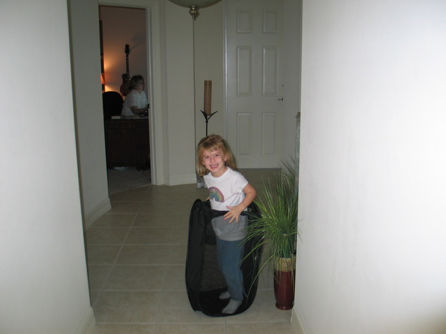 Here's Paige having fun with Grandma Marty's laundry holder!