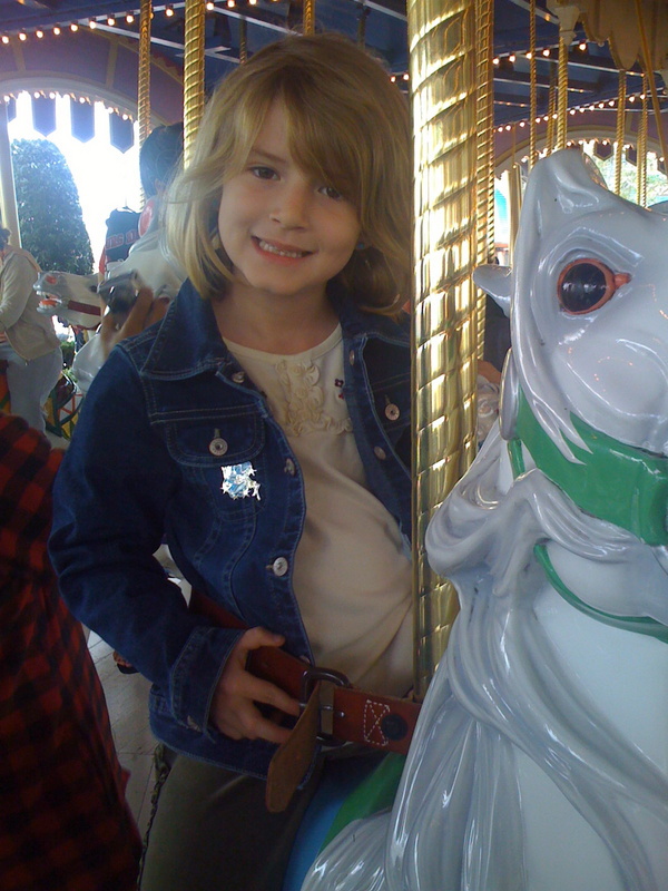 The crowds were definitely down today, so we set a record and hit 15 rides!  Here's Paige-E on the Carousel!