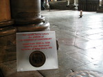 The candle burns where the shrine of St. Thomas of Canterbury stood before King Henry VIII ordered it to be taken down.