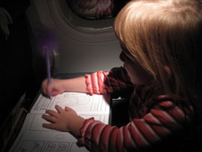 While we flew, after the questions and answers.  Josie worked in her workbook (Thank you to Grandma Marty for lining us up with books to work on and read for the trip!)