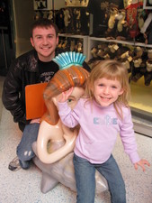 Uncle Adam sits on the mermaid while Josie rides up front.