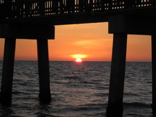 Sunset through the pier.