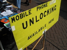 All over the place you could get your mobile phone unlocked (for use with other carriers).  This guy had a both at a farmers market.