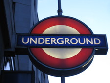 The London Underground (subway), crowded, and deep, deep underground.