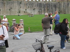 You see this everywhere.  People taking photos of others 'holding up the tower'...