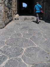 The bumpy stone road into the city.