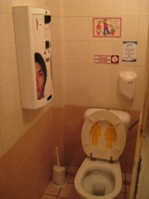 Unlike Italy, the bathrooms have toilet seats.  This particular one had a condom machine on the wall too. 