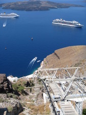 A view of the beginning of the cable car, two cruise ships and the volcano.