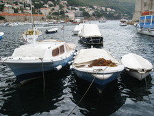 An interesting shot of three boats of varying sizes.