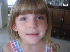 Hey Dad!  What do you think of my earrings?  Mel-Mel and I are trying on different jewelry!