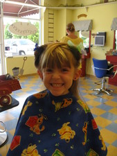 Josie got to ride a horse while she watched a TV Show when she got her hair cut. :)