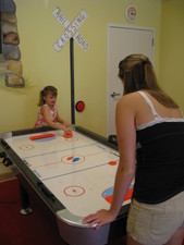 Paige got to play some air hockey with Aunt Kate while we waited for JoJo...