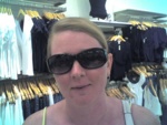 Mel is having a blast trying on sunglasses!