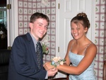 Adam puts the Corsage on Lauren's wrist...