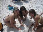 court, daisy, and bre covering up brian in sand