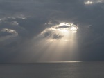 Awesome photo taken of the sun coming through the clouds near Grand Cayman - taken by Dad.