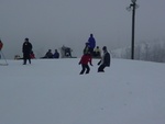 Sam taking a stab at snowboarding.